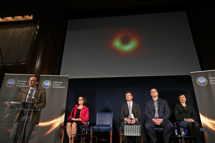 WASHINGTON, DC - APRIL 10: (L-R) Event Horizon Telescope Director Sheperd Doeleman, National Science Foundation Director France Cordova, University of Arizona Associate Professor of Astronomy Dan Marrone, University of Waterloo Associate Professor Avery Broderick and University of Amsterdam Professor of Theoretical High Energy Astrophysics Sera Markoff reveal the first photograph of a black hole during a news conference organized at the National Press Club April 10, 2019 in Washington, DC. A network of eight radio observatories on six mountains and four continents, the EHT observed a black hole in Messier 87, a supergiant elliptical galaxy in the constellation Virgo, on and off for 10 days in April of 2017 to make the image. Chip Somodevilla/Getty Images/AFP